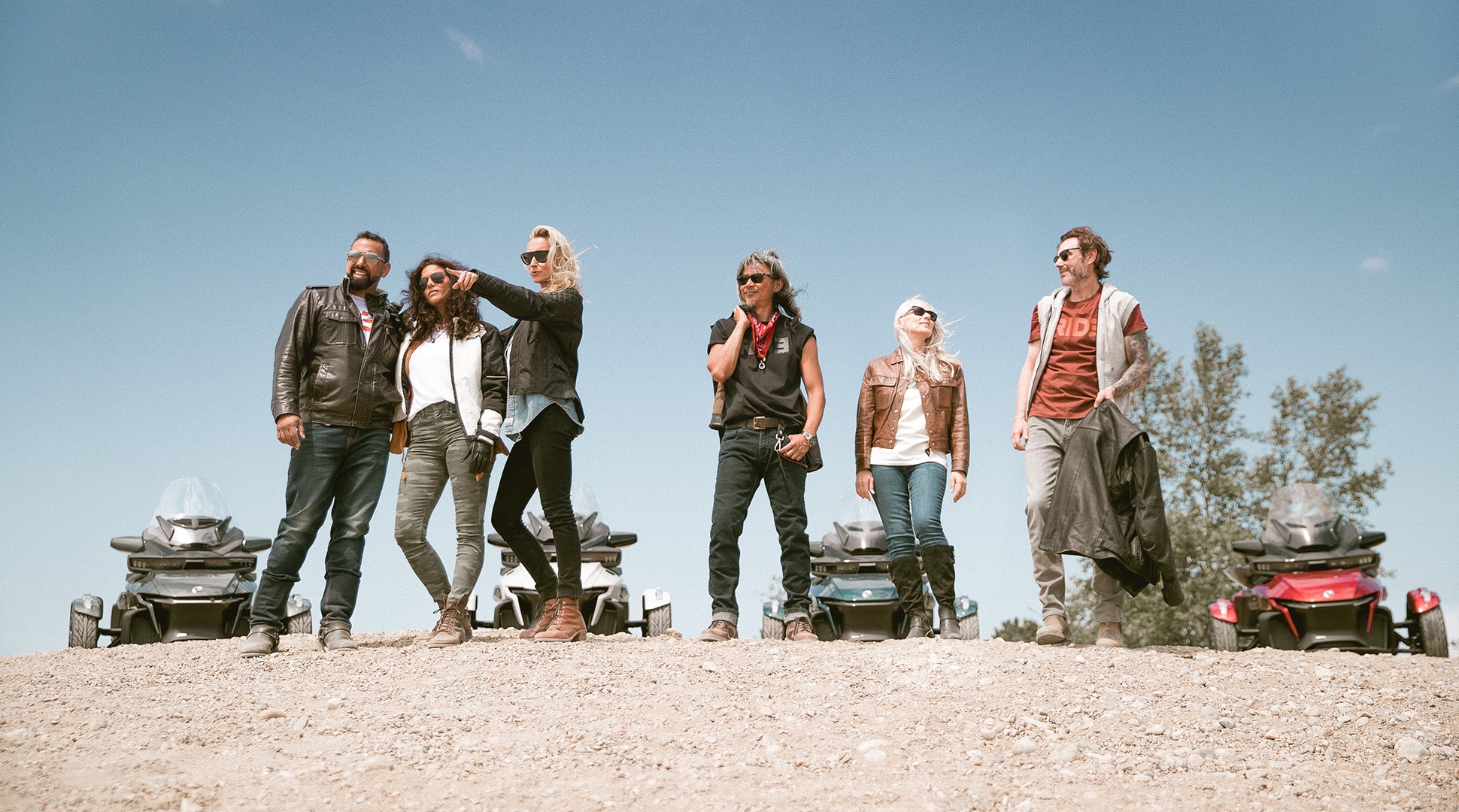 Group of riders with vehicles